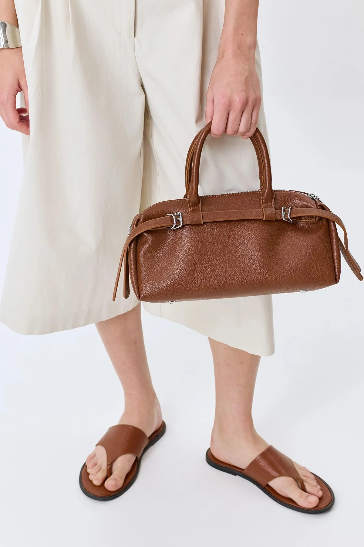 Коричневая сумка-багет с декоративными ремешками, One